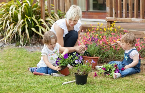 Team member preparing equipment for garden maintenance